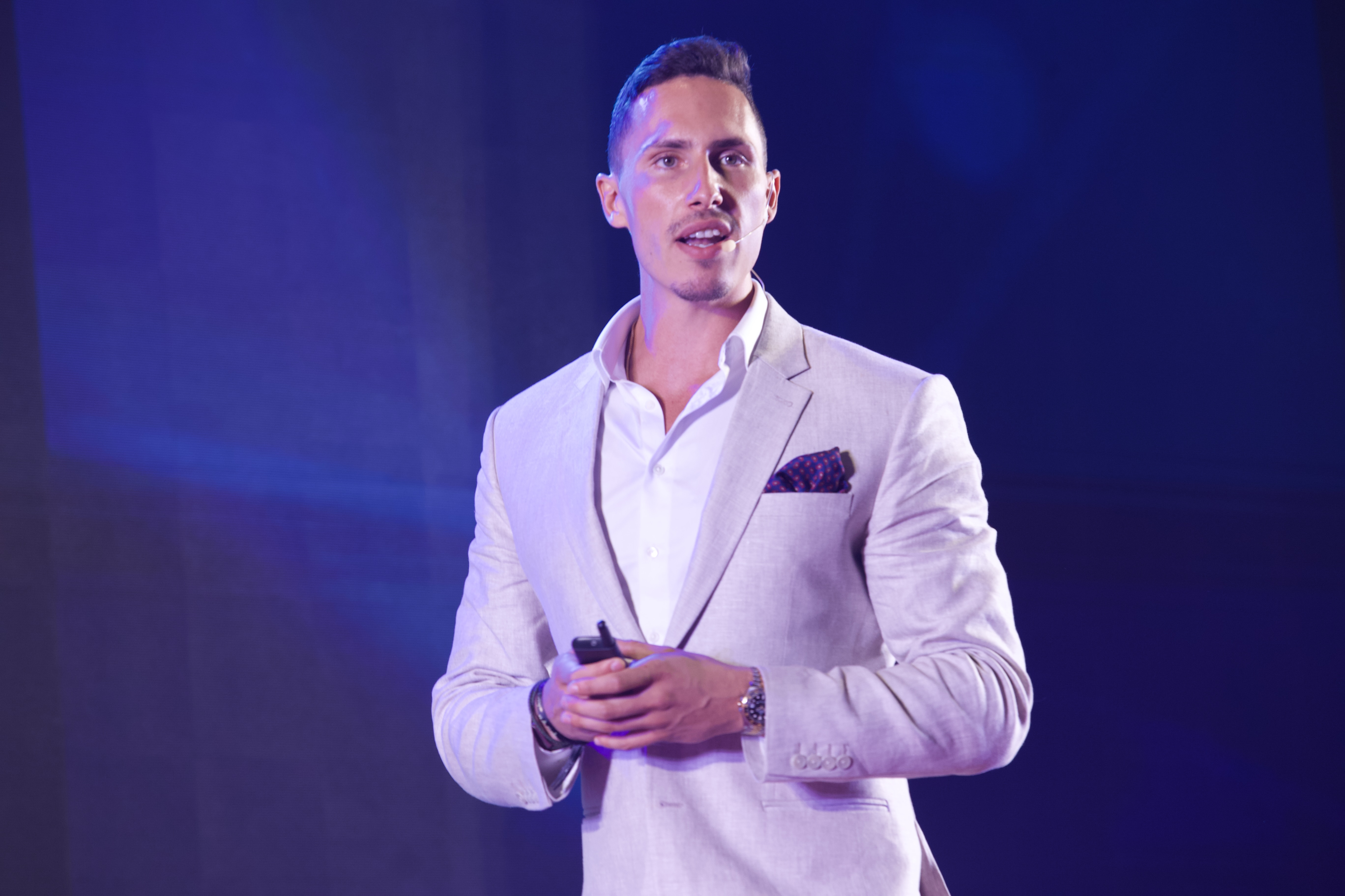 Emil speaking on stage